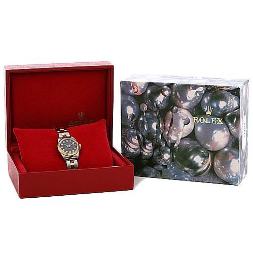 The Rolex Datejust 79173 Women's Stainless Steel Black Dial 79173 Women's Stainless Steel Black Dial watch is shown in an open red box next to its decorative outer packaging.
