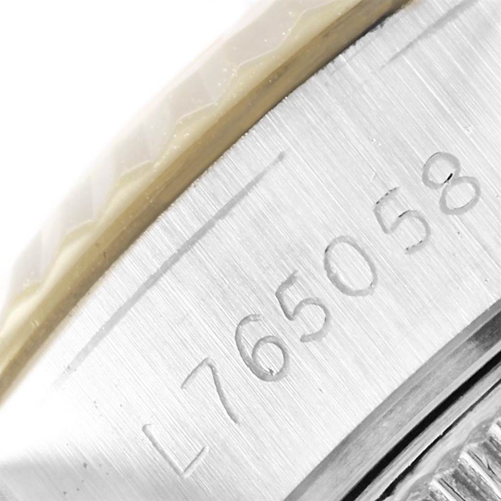 This image shows a close-up of the serial number engraved on the side of a Rolex Datejust 69173 Women's Stainless Steel Champagne Dial 69173 Women's Stainless Steel Champagne Dial watch's case.