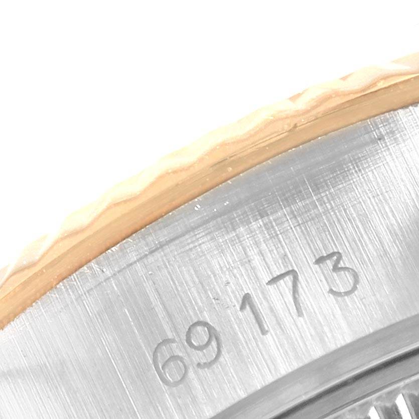 Close-up of the Rolex Datejust 69173 Women's Stainless Steel Champagne Dial 69173 Women's Stainless Steel Champagne Dial model 69173, focusing on the case edge and serial number.