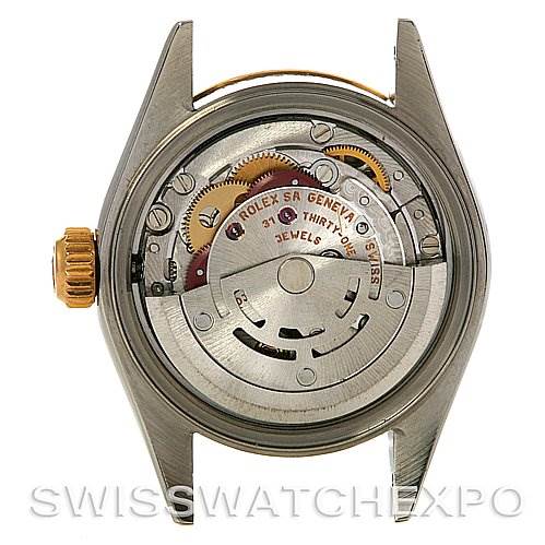This image shows the back view of a Rolex Datejust 79173 Women
s Stainless Steel Silver Dial 79173 Women
s Stainless Steel Silver Dial model, revealing its inner mechanical movement and components.