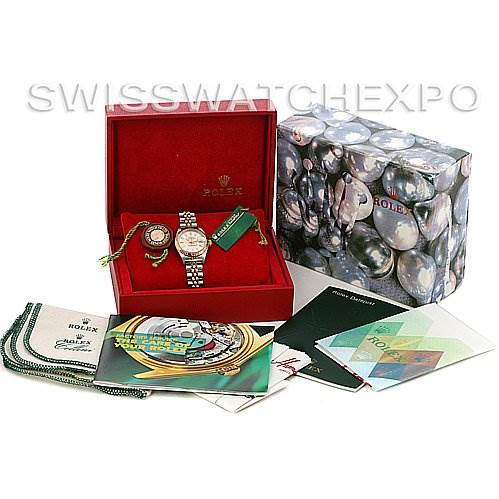 This image shows a Rolex Datejust 79173 Women
s Stainless Steel Silver Dial 79173 Women
s Stainless Steel Silver Dial watch at an angle showcasing the front, inside a red box with accompanying booklets and accessories.