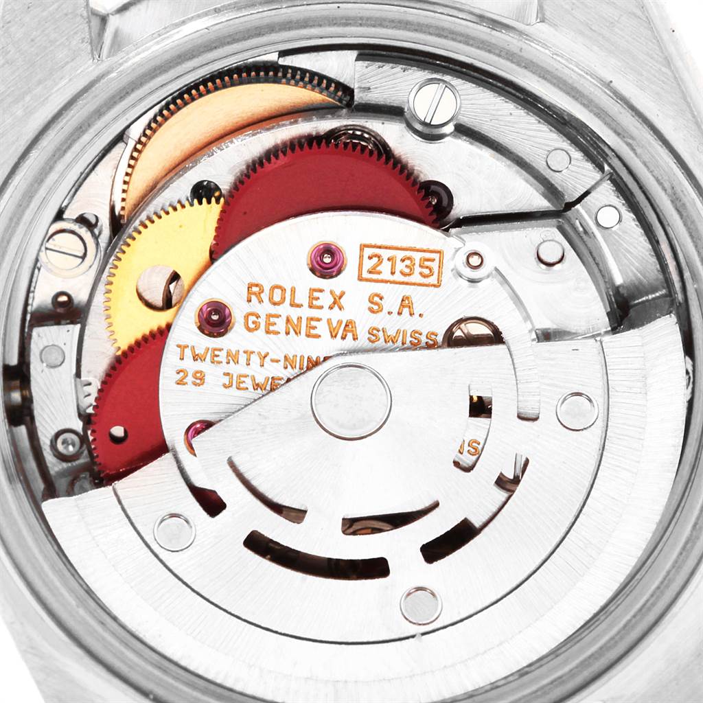 This is a close-up view of the internal mechanism of a Rolex Datejust 69174 Women
s Stainless Steel Silver Dial 69174 Women
s Stainless Steel Silver Dial watch, showcasing the gears and intricate components.
