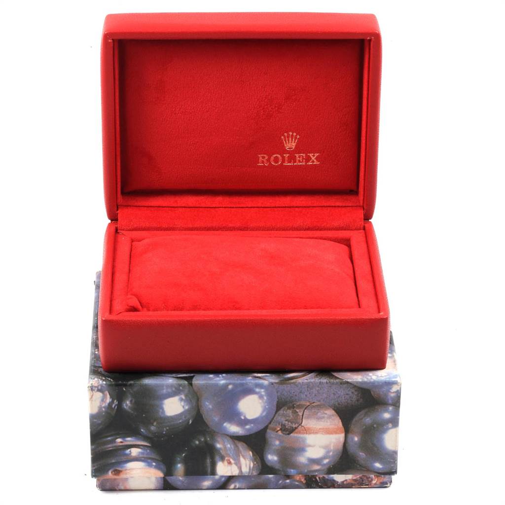 The image shows an open, empty Rolex Datejust 69174 Women
s Stainless Steel Silver Dial 69174 Women
s Stainless Steel Silver Dial watch box, lined with red fabric and featuring the Rolex logo.