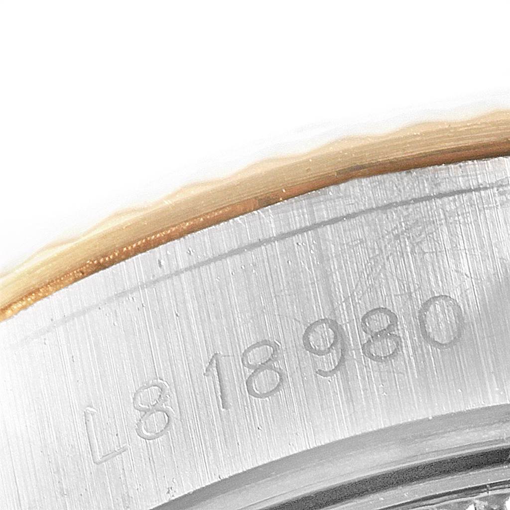 The image shows a close-up of the serial number engraved on the case back of a Rolex Datejust 69173 Women's Stainless Steel Champagne Dial 69173 Women's Stainless Steel Champagne Dial watch.