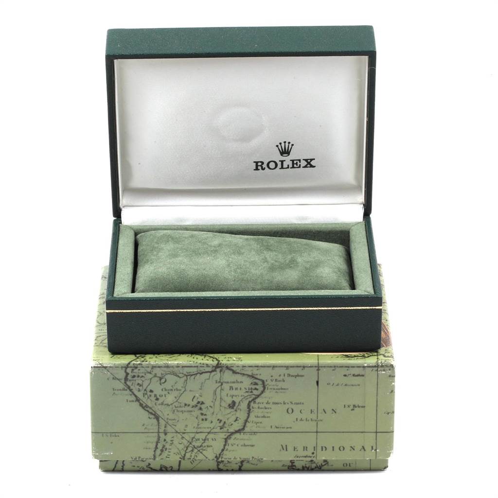 The image shows the opened green box of a Rolex Datejust 69173 Women's Stainless Steel Champagne Dial 69173 Women's Stainless Steel Champagne Dial watch, displaying its cushion and the Rolex logo inside.