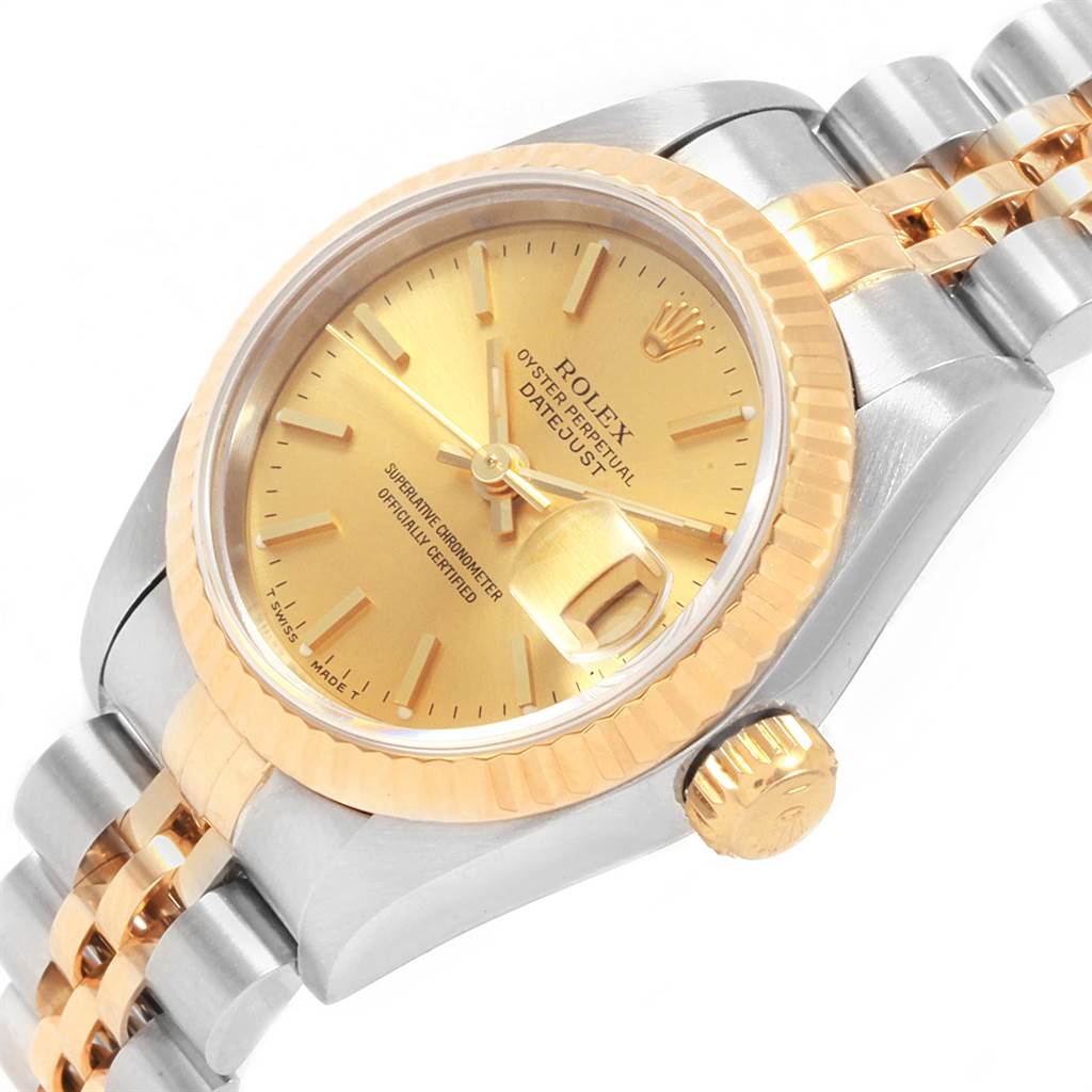This Rolex Datejust 69173 Women's Stainless Steel Champagne Dial 69173 Women's Stainless Steel Champagne Dial watch is shown at an angle displaying its gold dial, fluted bezel, Jubilee bracelet, and crown.