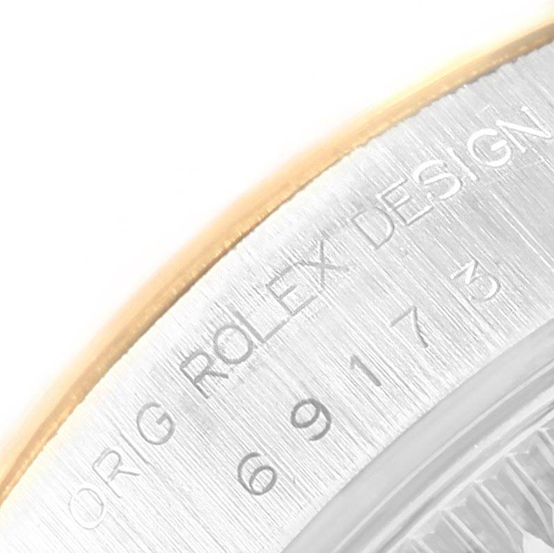 This close-up image shows the engraved text on the side of a Rolex Datejust 69173 Women's Stainless Steel Champagne Dial 69173 Women's Stainless Steel Champagne Dial watch case.