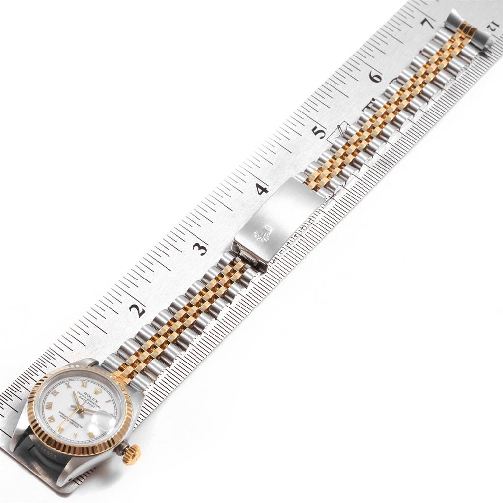 The Rolex Datejust 69173 Women's Stainless Steel White Dial 69173 Women's Stainless Steel White Dial watch is shown from a top-down angle, highlighting the face, crown, bezel, and two-tone jubilee bracelet.