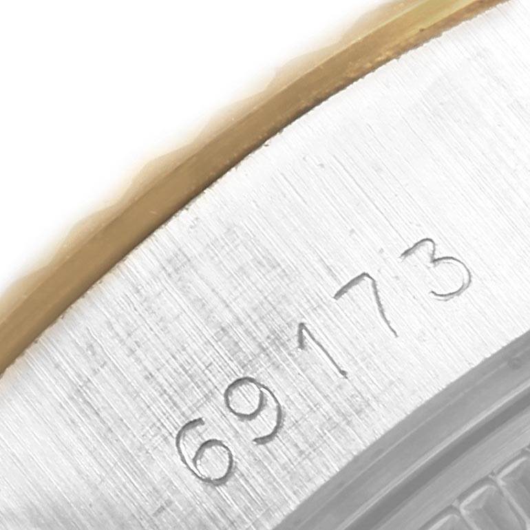This close-up image shows the edge of the bezel and part of the case of a Rolex Datejust 69173 Women's Stainless Steel White Dial 69173 Women's Stainless Steel White Dial watch, displaying its model number 69173.