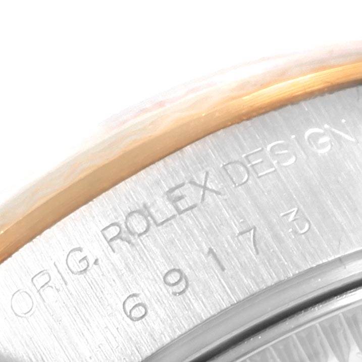 The image shows a close-up of the back casing of the Rolex Datejust 69173 Women's Stainless Steel Champagne Dial 69173 Women's Stainless Steel Champagne Dial watch, highlighting the engraved text "Orig. Rolex Design."