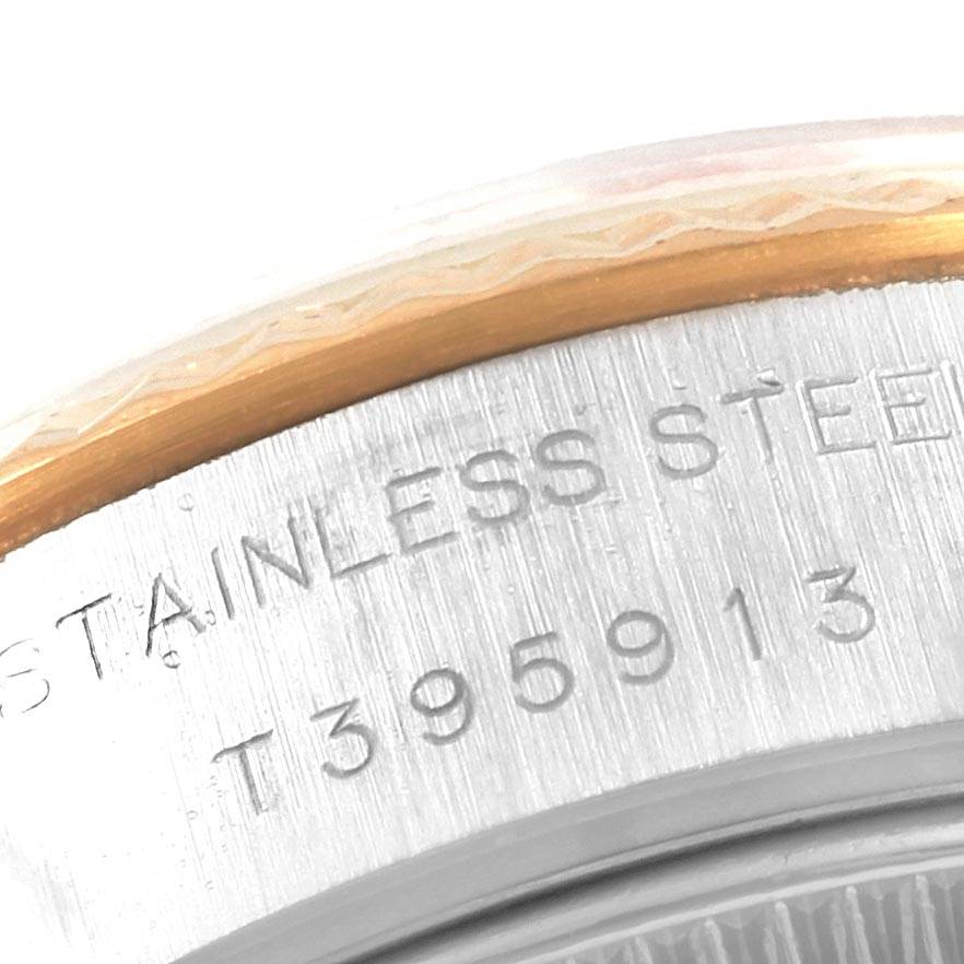 Close-up of the case back edge of a Rolex Datejust 69173 Women's Stainless Steel Champagne Dial 69173 Women's Stainless Steel Champagne Dial watch, showing the stainless steel engraving and serial number.