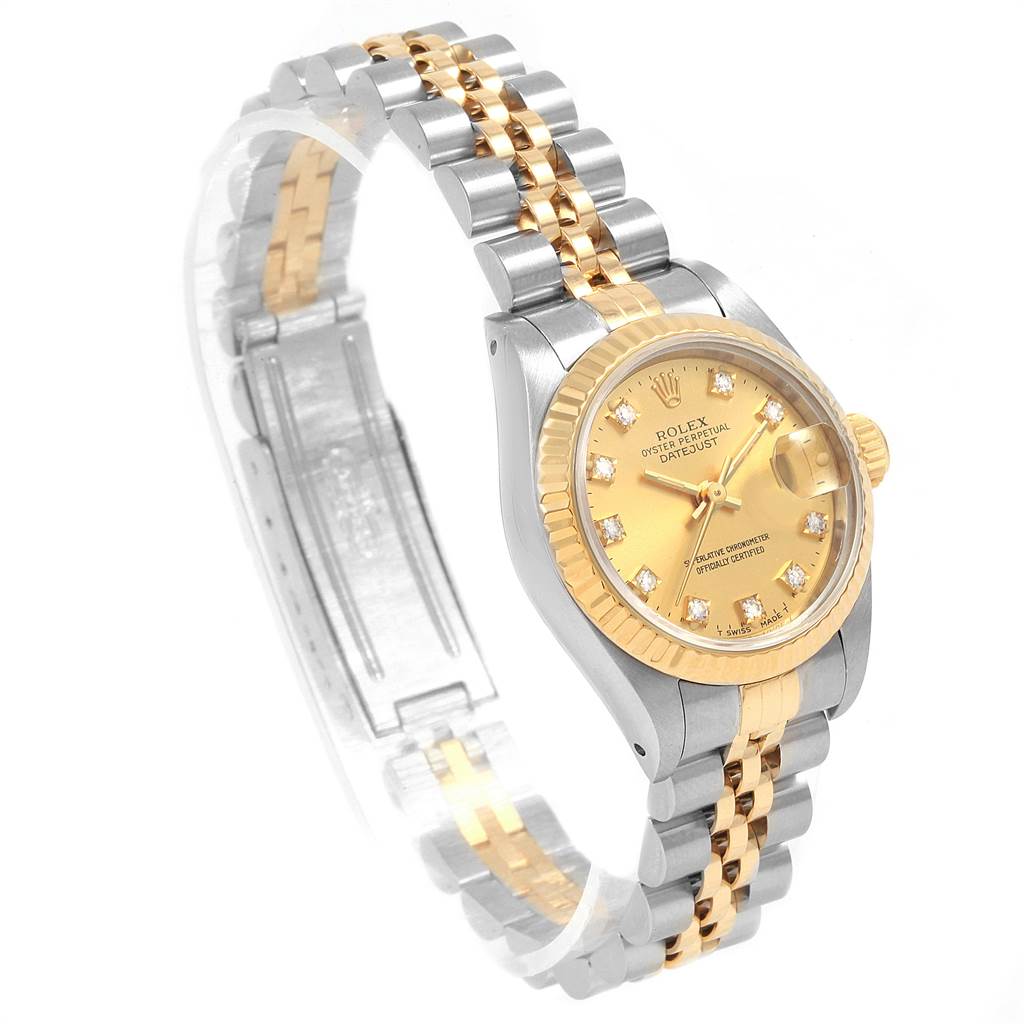 The image shows a side and angled view of a Rolex Datejust 69173 Women's Stainless Steel Champagne Dial 69173 Women's Stainless Steel Champagne Dial watch, highlighting its gold and silver jubilee bracelet and fluted bezel.