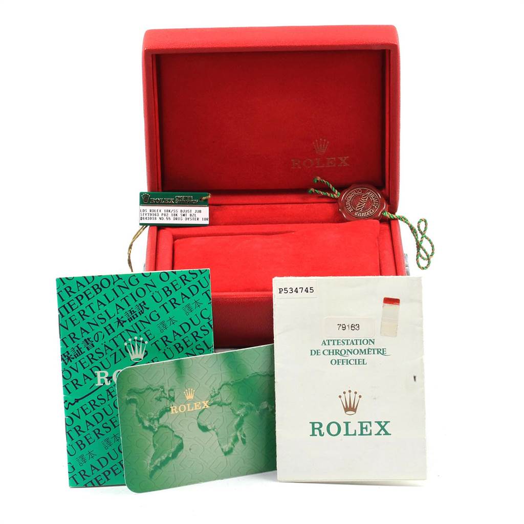 The image displays the accessories for a Rolex Datejust 79163 Women's Steel and Gold (two tone) Silver Dial 79163 Women's Steel and Gold (two tone) Silver Dial watch, including an open red box, documentation, and tags.