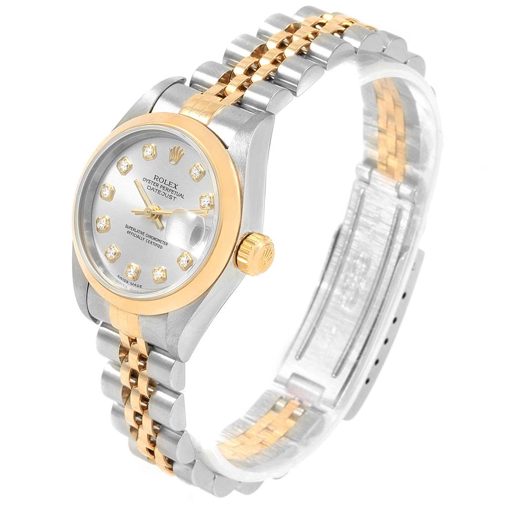 This Rolex Datejust 79163 Women's Steel and Gold (two tone) Silver Dial 79163 Women's Steel and Gold (two tone) Silver Dial watch is shown at a slight angle featuring its face, bezel, crown, and two-tone bracelet.