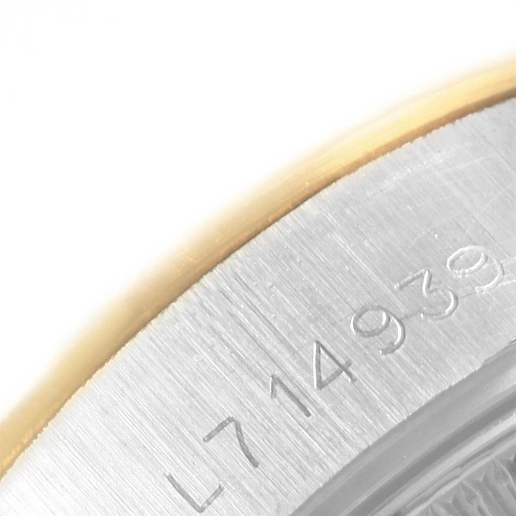 This image shows a close-up of the serial number engraved on the case of a Rolex Datejust 69173 Women's Stainless Steel Champagne Dial 69173 Women's Stainless Steel Champagne Dial.