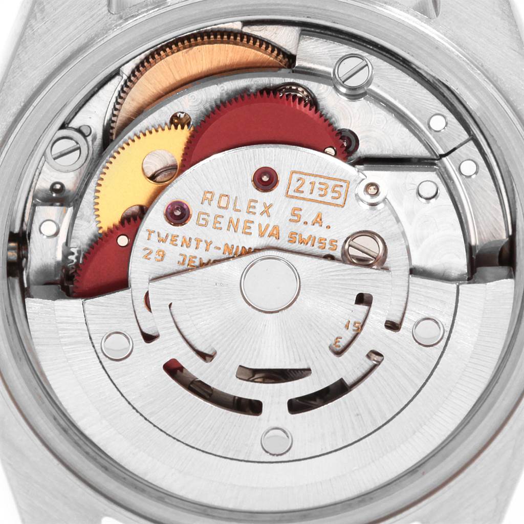 This image shows a close-up view of the internal mechanism of a Rolex Datejust 69173 Women's Stainless Steel Champagne Dial 69173 Women's Stainless Steel Champagne Dial watch, highlighting its gears and components.