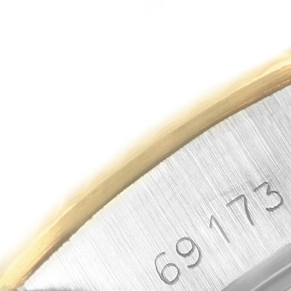 The image shows a close-up angle of the serial number engraved on the case of a Rolex Datejust 69173 Women's Stainless Steel Champagne Dial 69173 Women's Stainless Steel Champagne Dial watch, model 69173.