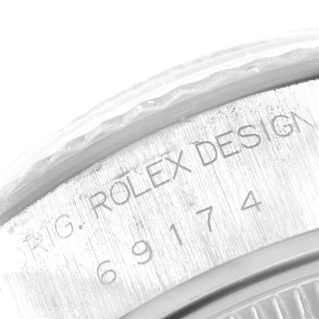 The image shows a close-up of the case back engraving on a Rolex Datejust 69174 Women's Stainless Steel Silver Dial 69174 Women's Stainless Steel Silver Dial watch.
