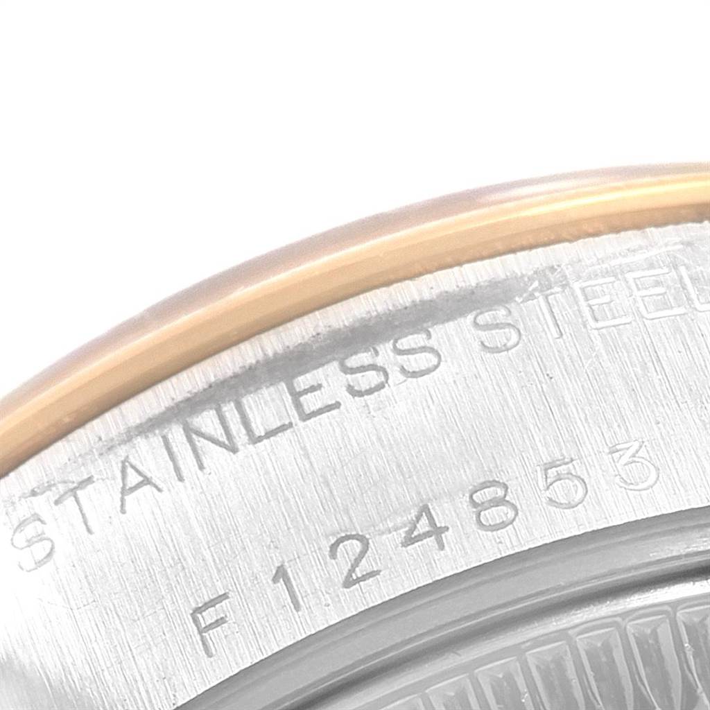This close-up image shows the stainless steel case back and serial number of a Rolex Datejust 79163 Women
s Steel and Gold (two tone) Silver Dial 79163 Women
s Steel and Gold (two tone) Silver Dial watch.