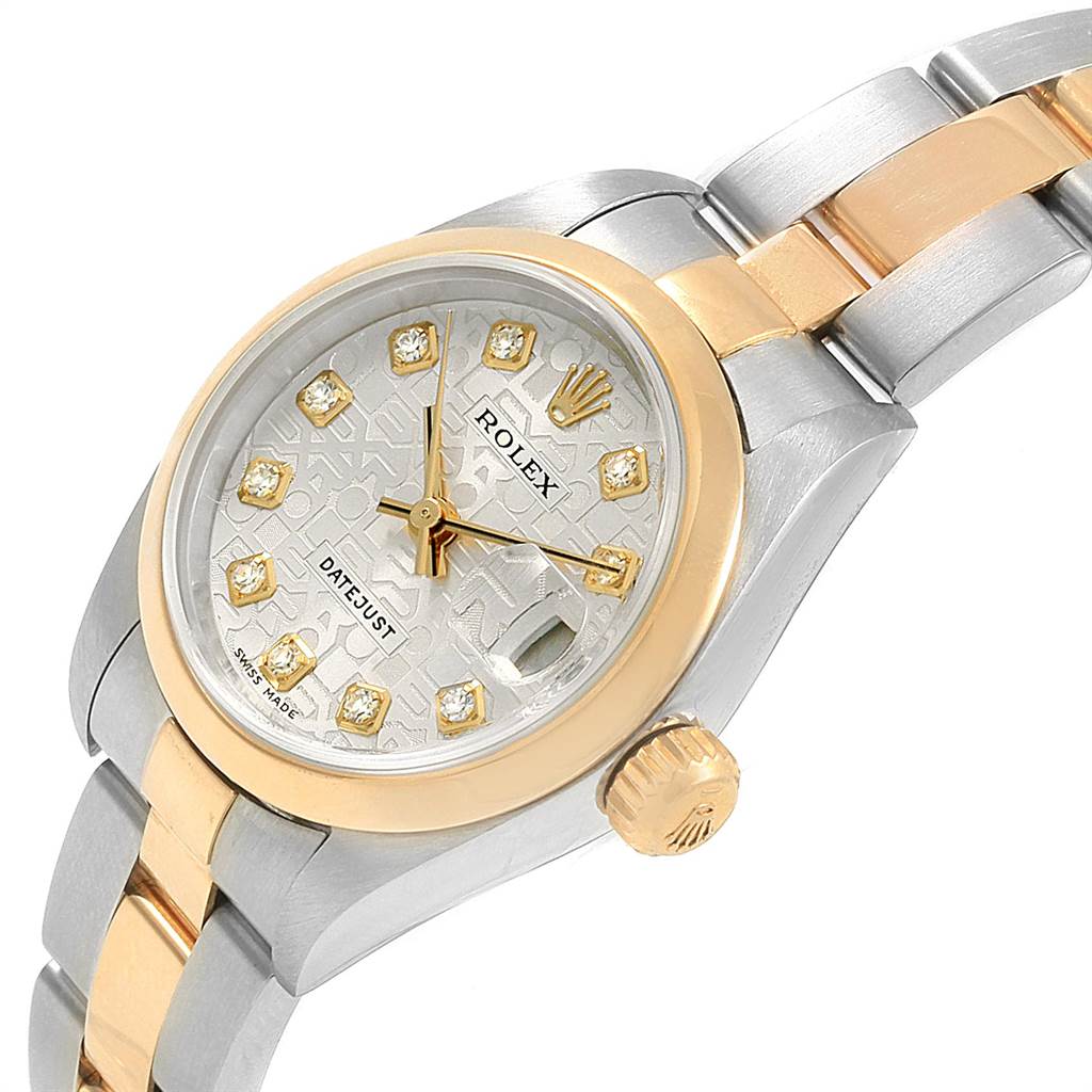 The image shows a close-up, angled view of a Rolex Datejust 79163 Women
s Steel and Gold (two tone) Silver Dial 79163 Women
s Steel and Gold (two tone) Silver Dial watch highlighting its dial, crown, and part of the bracelet.