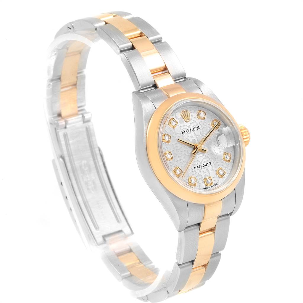 The image shows a Rolex Datejust 79163 Women
s Steel and Gold (two tone) Silver Dial 79163 Women
s Steel and Gold (two tone) Silver Dial watch angled to display its face, bezel, and two-tone bracelet.