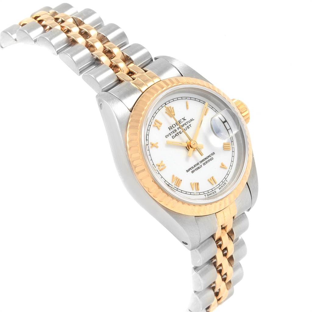 The Rolex Datejust 69173 Women's Stainless Steel White Dial 69173 Women's Stainless Steel White Dial watch is shown at an angle highlighting its two-tone bracelet, fluted bezel, and white dial with Roman numerals.