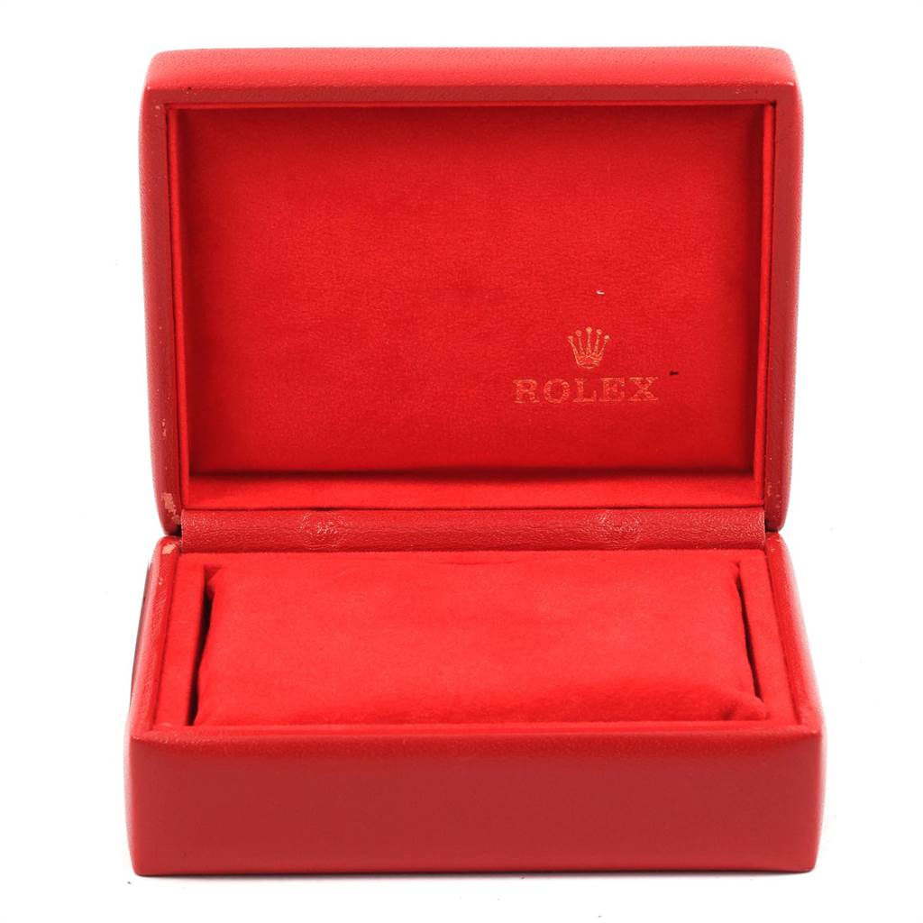 This image shows a red Rolex Datejust 79173 Women's Steel and Gold (two tone) Silver Dial 79173 Women's Steel and Gold (two tone) Silver Dial watch box with the lid open, displaying the cushion compartment.