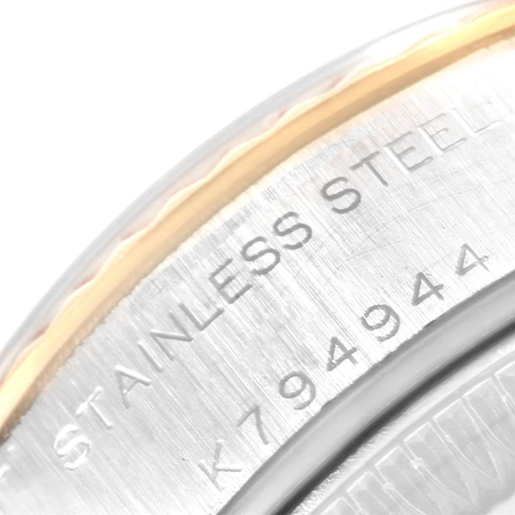 This image shows a close-up of the case back of a Rolex Datejust 79173 Women's Steel and Gold (two tone) Silver Dial 79173 Women's Steel and Gold (two tone) Silver Dial watch, displaying its stainless steel material and serial number.