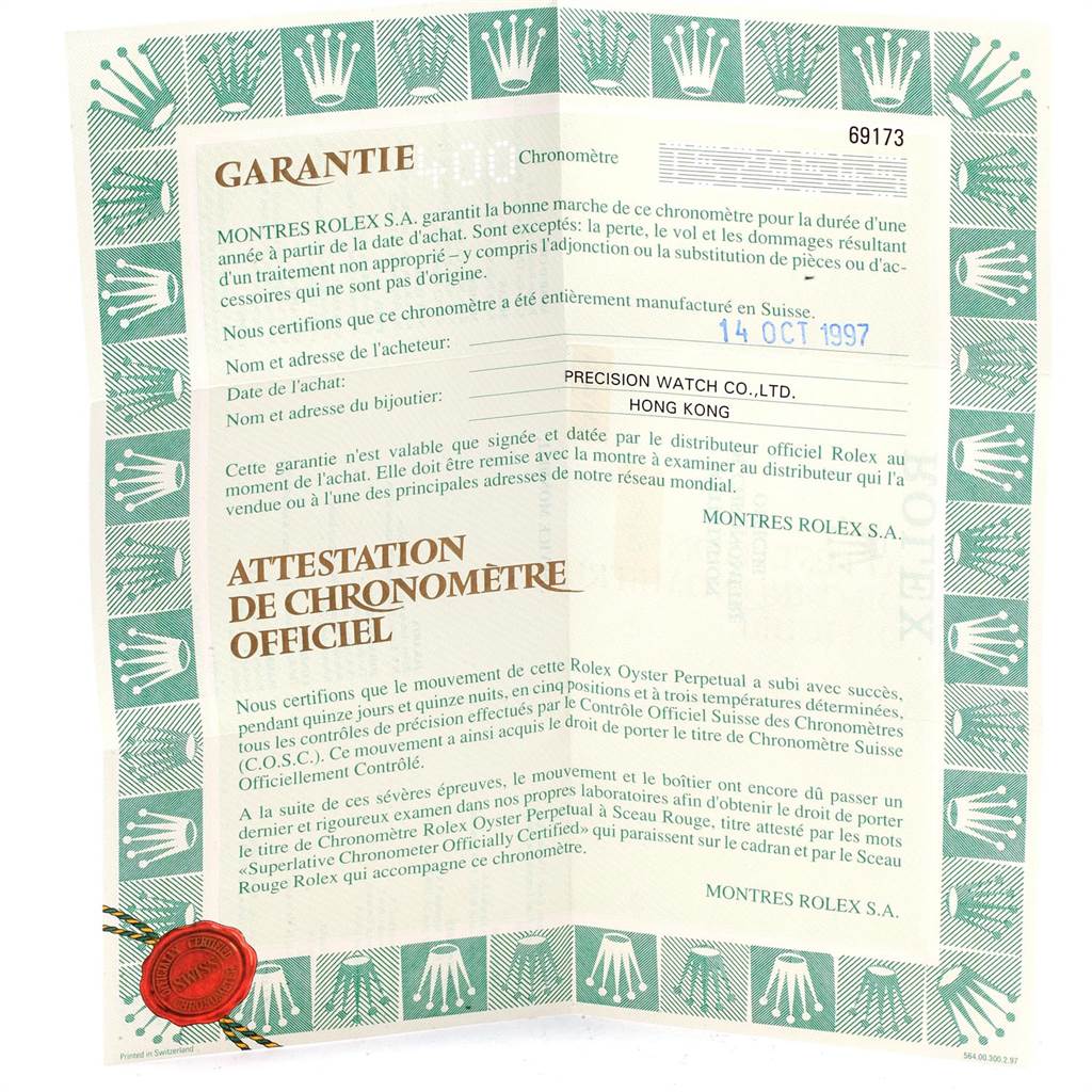 This image shows the warranty and certification document for the Rolex Datejust 69173 Women's Stainless Steel White Dial 69173 Women's Stainless Steel White Dial model from an overhead angle.