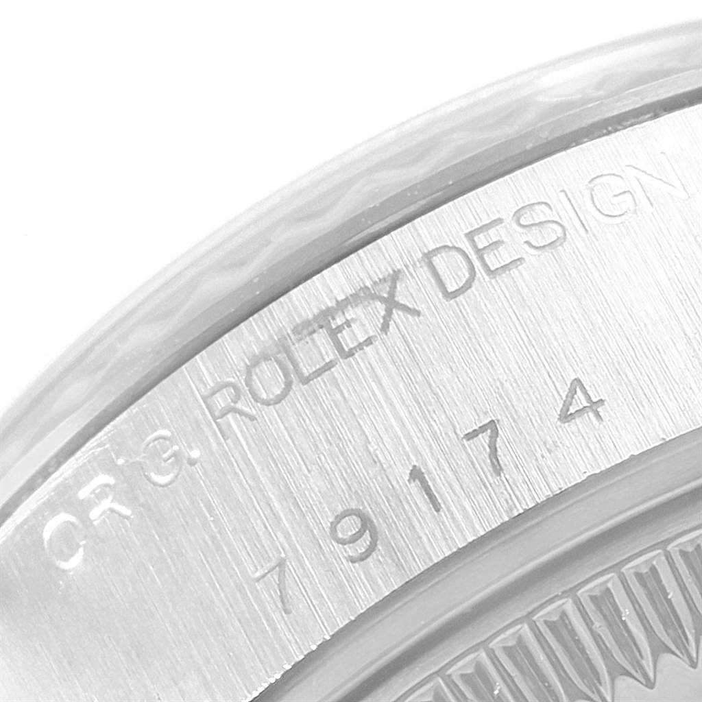 This is a close-up image of the engraved case back of a Rolex Datejust 79174 Women
s Stainless Steel Silver Dial 79174 Women
s Stainless Steel Silver Dial watch.