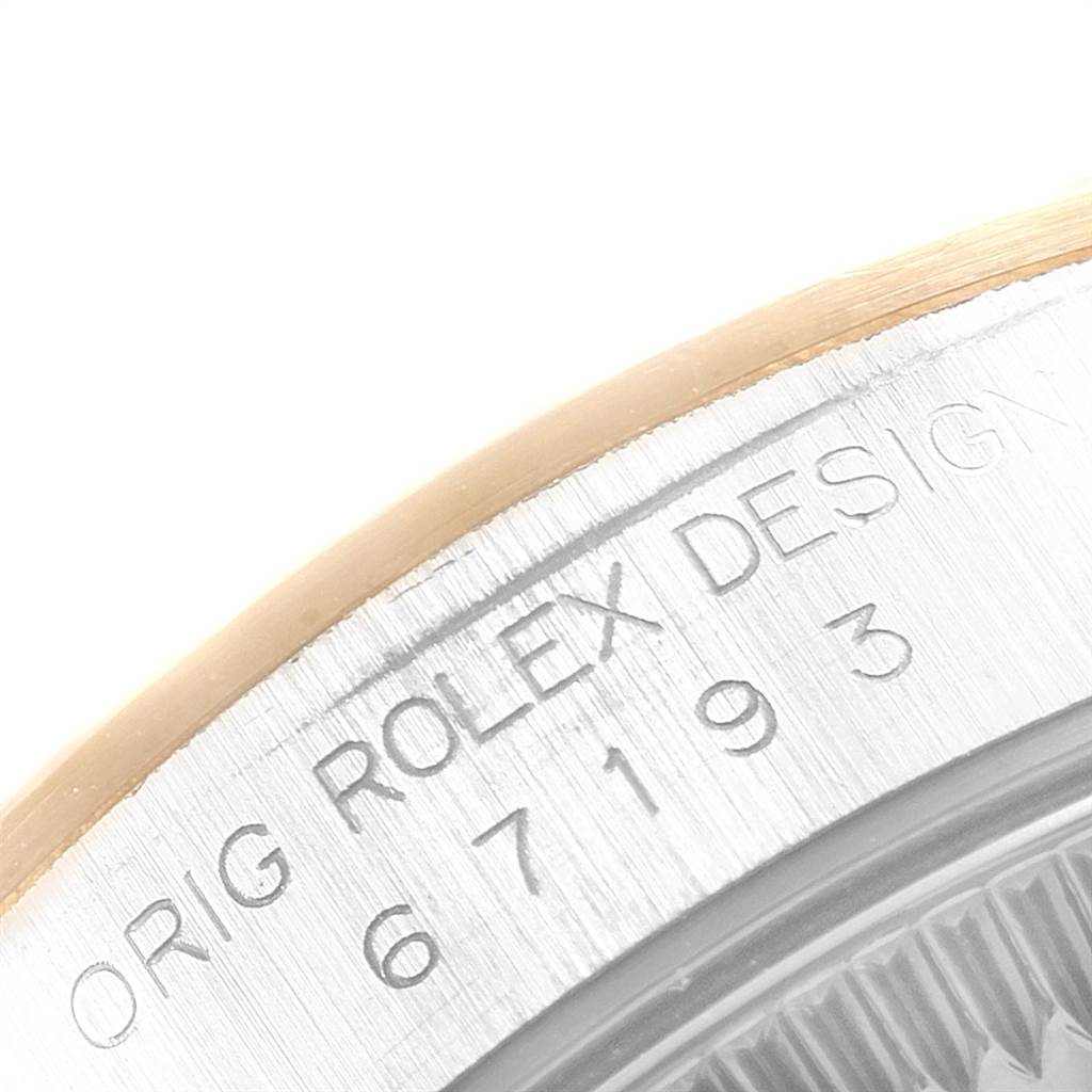 This close-up shows the side engraving on the bezel of a Rolex Datejust 69173 Women's Stainless Steel White Dial 69173 Women's Stainless Steel White Dial watch.