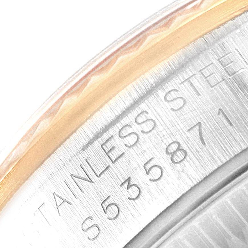 This image shows a close-up of the case back and edge of the bezel of a Rolex Datejust 69173 Women's Stainless Steel White Dial 69173 Women's Stainless Steel White Dial watch.