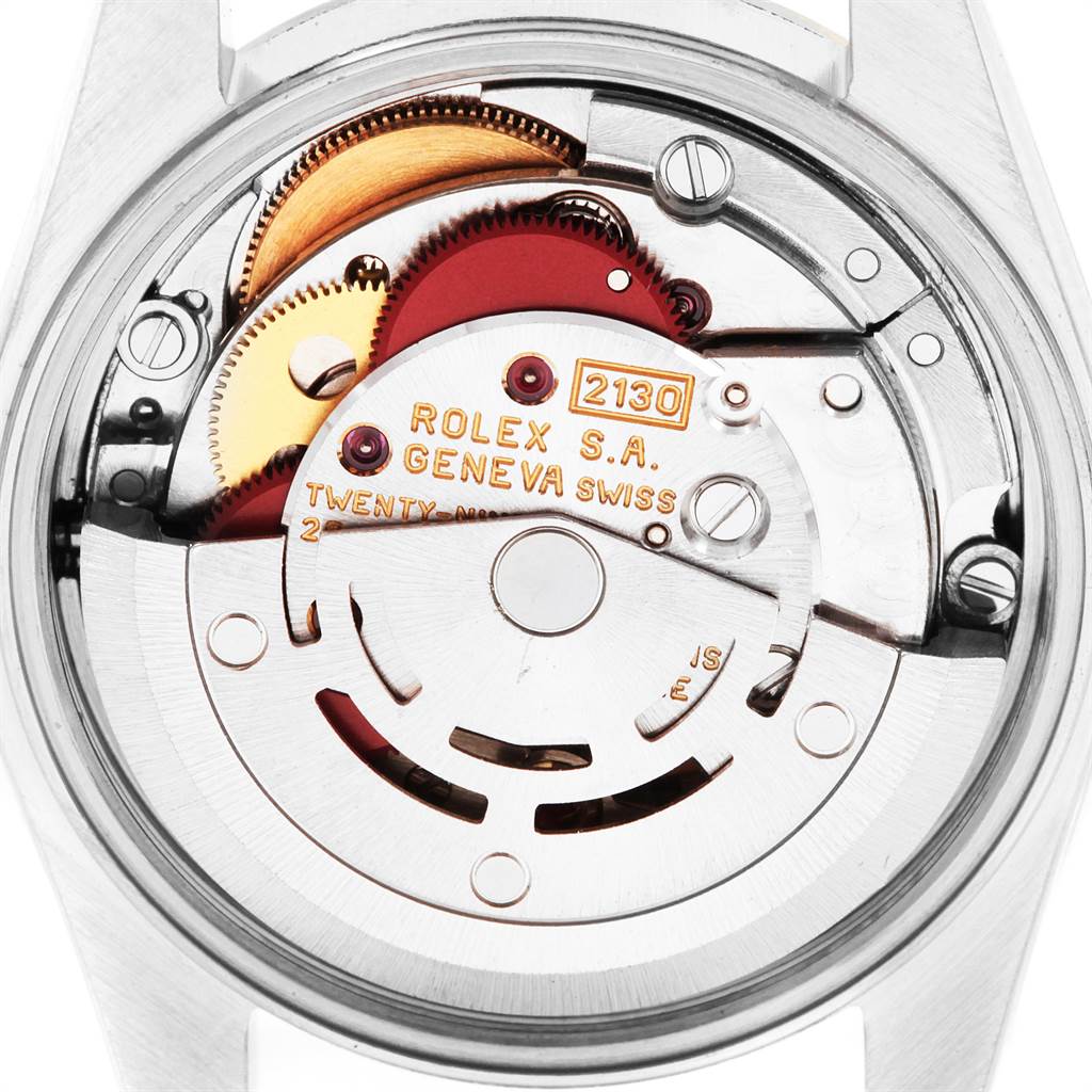 This is a close-up view of the movement mechanism of a Rolex Datejust 69173 Women's Stainless Steel White Dial 69173 Women's Stainless Steel White Dial watch, showcasing the intricate gears and engravings.