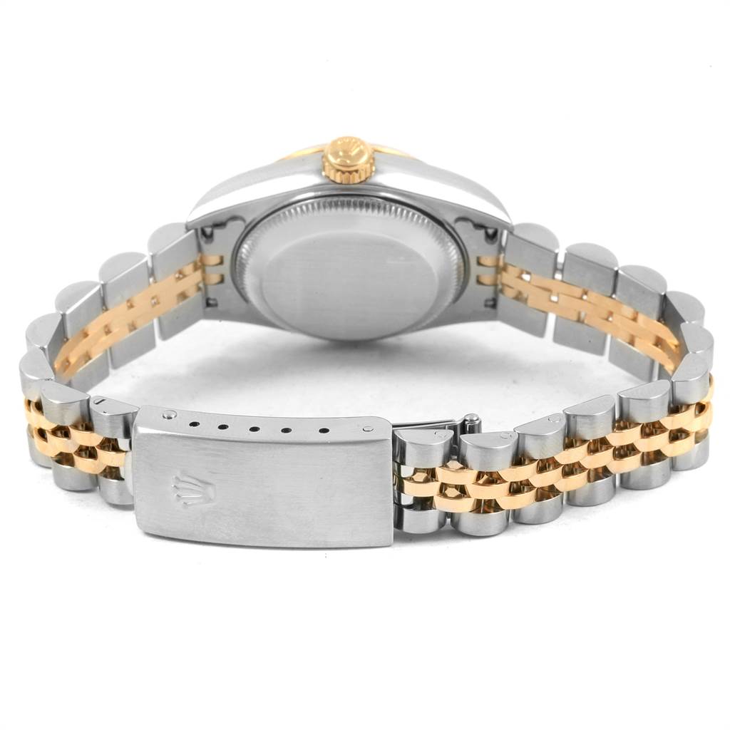The image shows the back of a Rolex Datejust 79173 Women
s Steel and Gold (two tone) Black Dial 79173 Women
s Steel and Gold (two tone) Black Dial watch, highlighting the clasp, bracelet, case back, and crown.