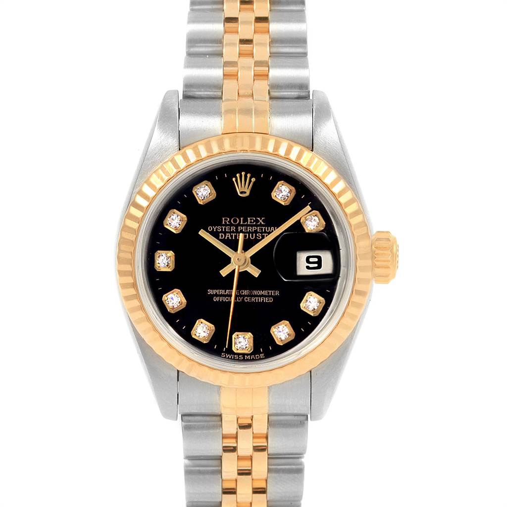 The image shows a Rolex Datejust 79173 Women
s Steel and Gold (two tone) Black Dial 79173 Women
s Steel and Gold (two tone) Black Dial watch from a front angle, displaying its black dial, date window, and two-tone band.