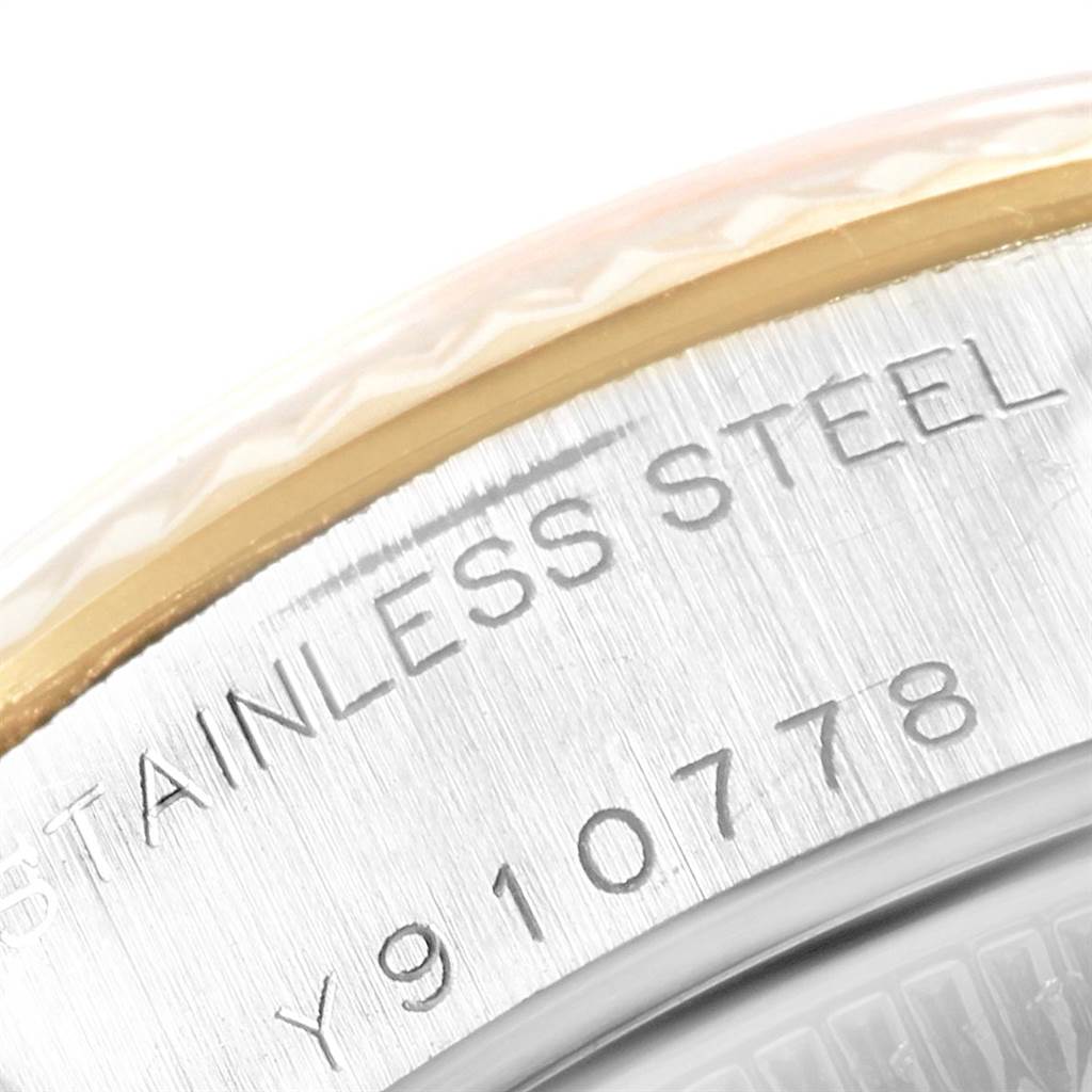This close-up angle shows the bezel and case of the Rolex Datejust 79173 Women's Steel and Gold (two tone) Black Dial 79173 Women's Steel and Gold (two tone) Black Dial, highlighting the stainless steel and serial number.