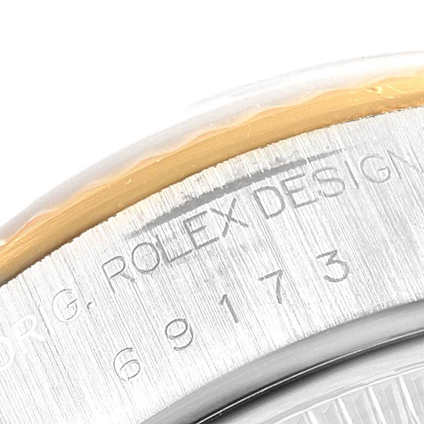 The image shows a close-up of the bezel and case side of a Rolex Datejust 69173 Women's Stainless Steel Black Dial 69173 Women's Stainless Steel Black Dial, highlighting the engravings.