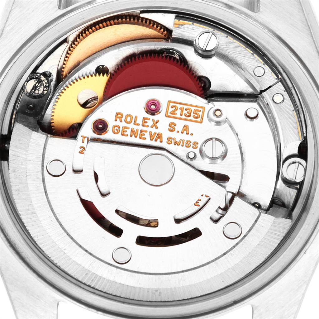 This image shows the movement of a Rolex Datejust 69173 Women's Stainless Steel Black Dial 69173 Women's Stainless Steel Black Dial watch, highlighting its intricate gears and inscriptions.