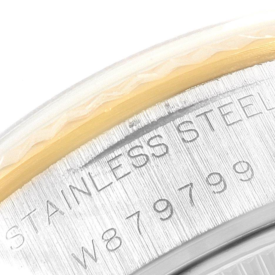 This close-up image shows part of the case back and serial number of a Rolex Datejust 69173 Women's Stainless Steel Black Dial 69173 Women's Stainless Steel Black Dial watch.
