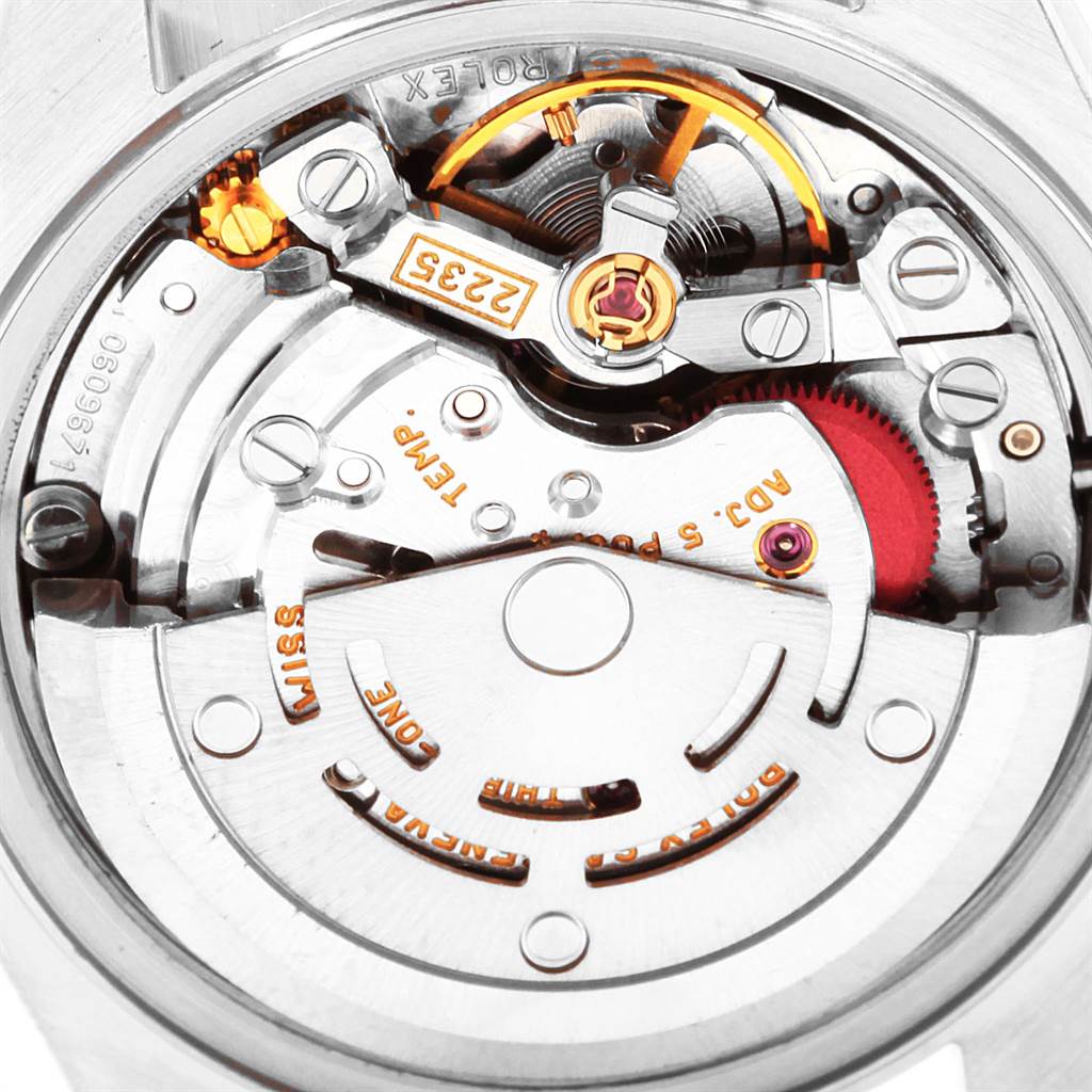 This image shows a close-up view of the internal movement mechanics of a Rolex Datejust 79174 Women
s Stainless Steel Pink Dial 79174 Women
s Stainless Steel Pink Dial watch.