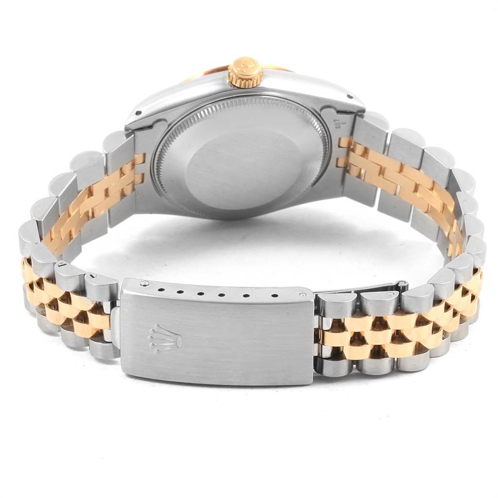 This image shows the case back and Jubillee bracelet with a clasp of a Rolex Datejust 68273 Women's Steel and Gold (two tone) Champagne Dial 68273 Women's Steel and Gold (two tone) Champagne Dial watch from a rear angle.