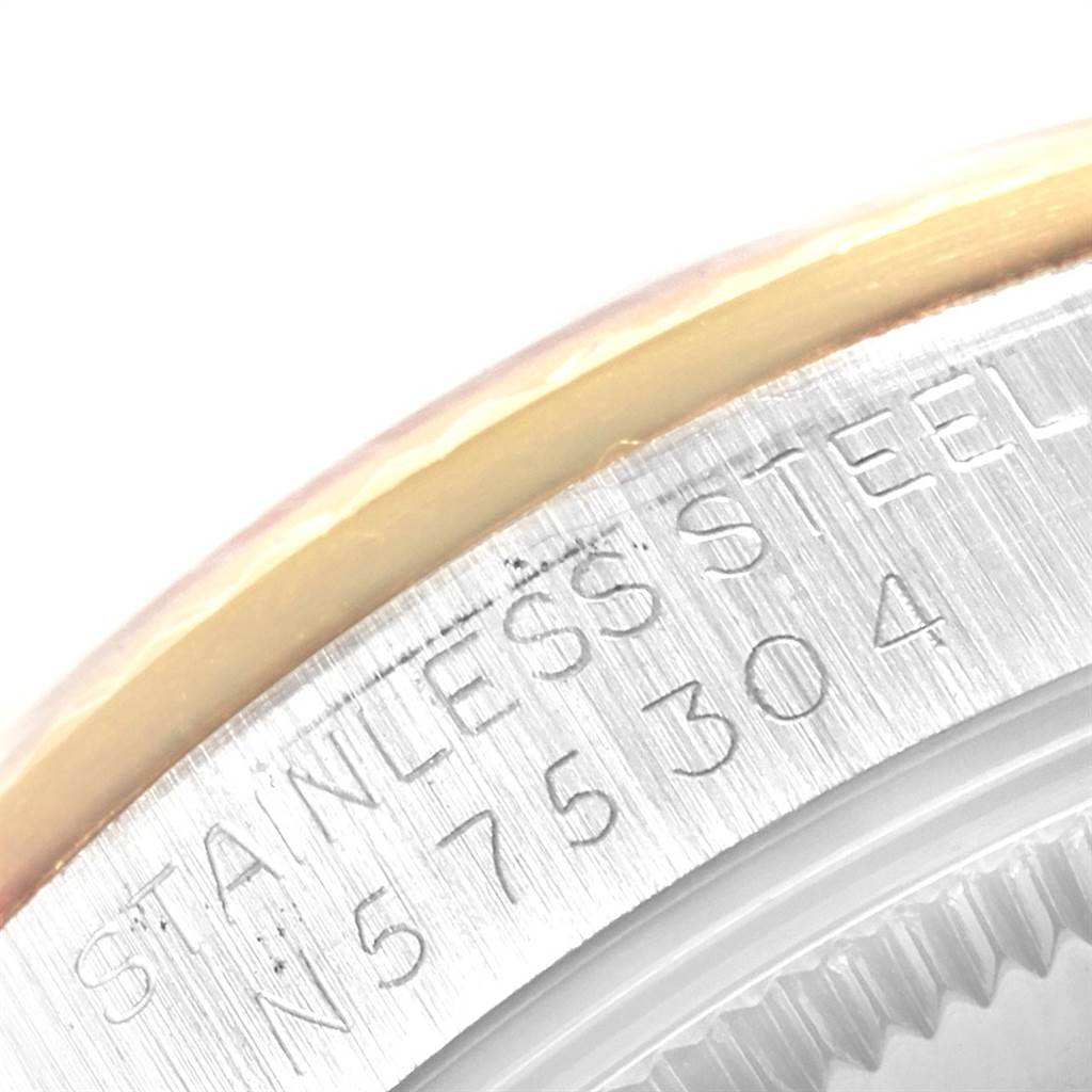 The image shows a close-up of the serial number engraving on the case edge of a Rolex Datejust 68273 Women's Steel and Gold (two tone) Champagne Dial 68273 Women's Steel and Gold (two tone) Champagne Dial watch.