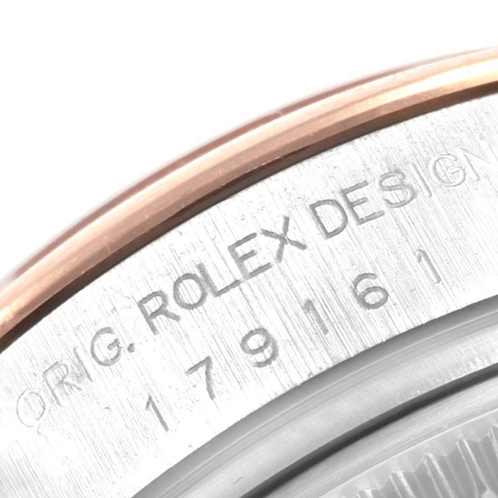 This image shows a close-up of the case back of the Rolex Datejust 179161 Women's Steel and Gold (two tone) Pink Dial 179161 Women's Steel and Gold (two tone) Pink Dial, highlighting the model number and "ROLEX DESIGN" engraving.