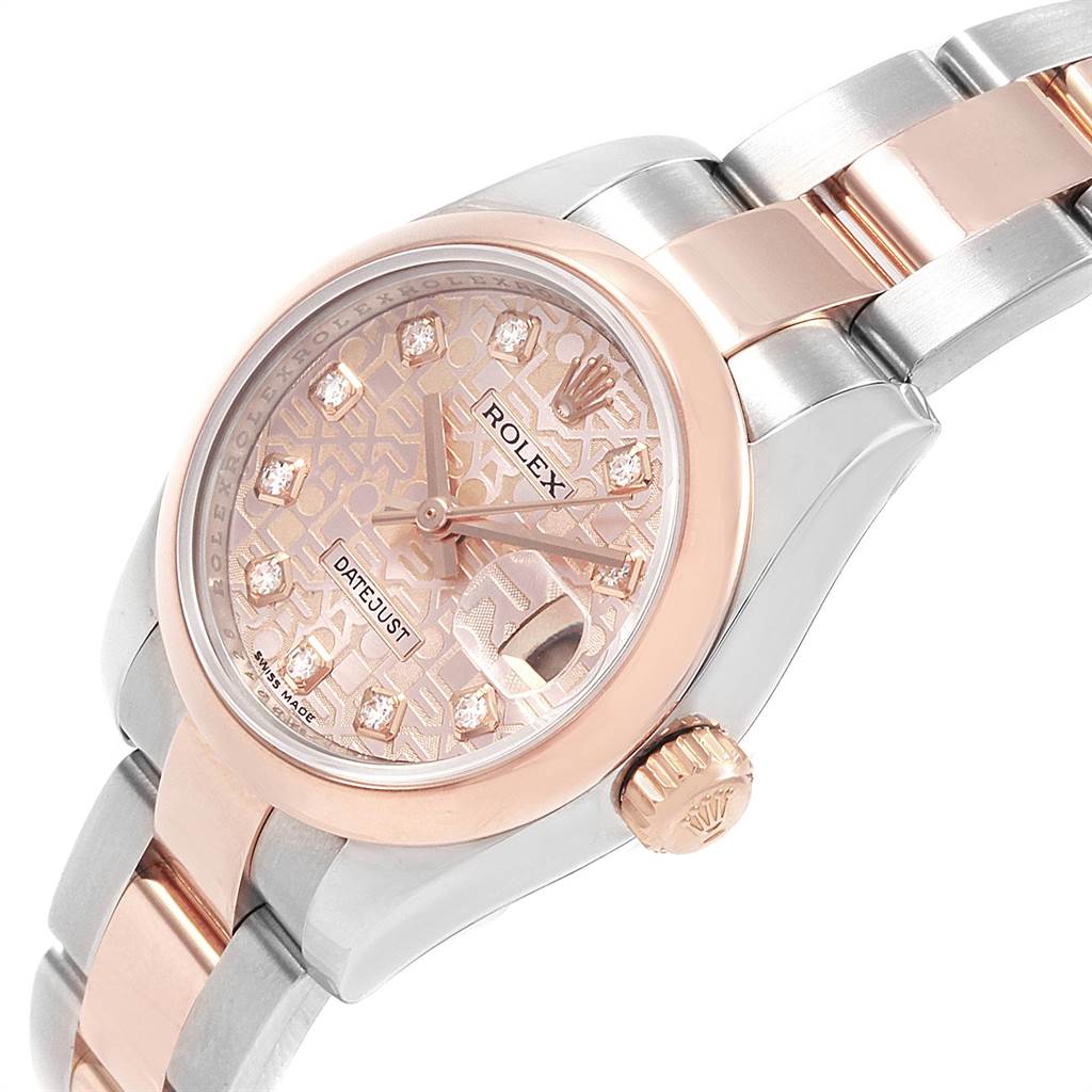 The image shows a partial view of a Rolex Datejust 179161 Women's Steel and Gold (two tone) Pink Dial 179161 Women's Steel and Gold (two tone) Pink Dial watch, focusing on the face, crown, and part of the bracelet at an angle.