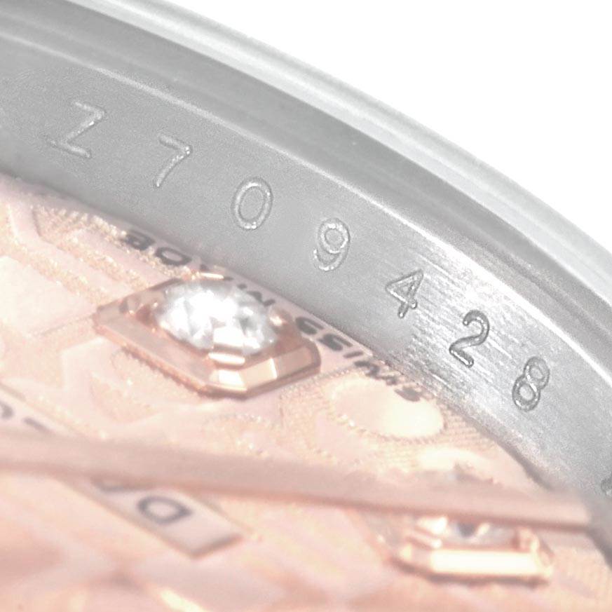 The image shows a close-up of the serial number and part of the dial of a Rolex Datejust 179161 Women's Steel and Gold (two tone) Pink Dial 179161 Women's Steel and Gold (two tone) Pink Dial watch.