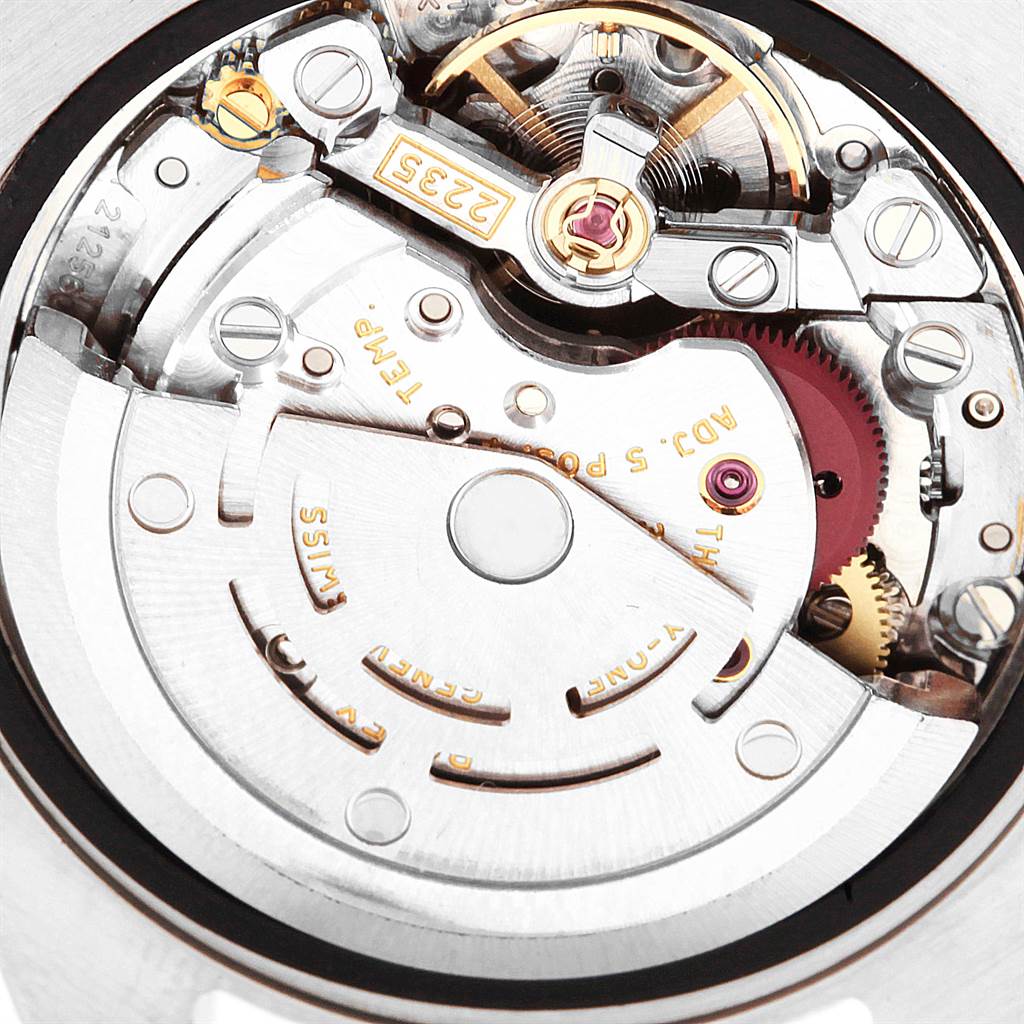 The image shows the intricate inner mechanical movement of a Rolex Datejust 179161 Women's Steel and Gold (two tone) Pink Dial 179161 Women's Steel and Gold (two tone) Pink Dial watch, focusing on its components and craftsmanship.