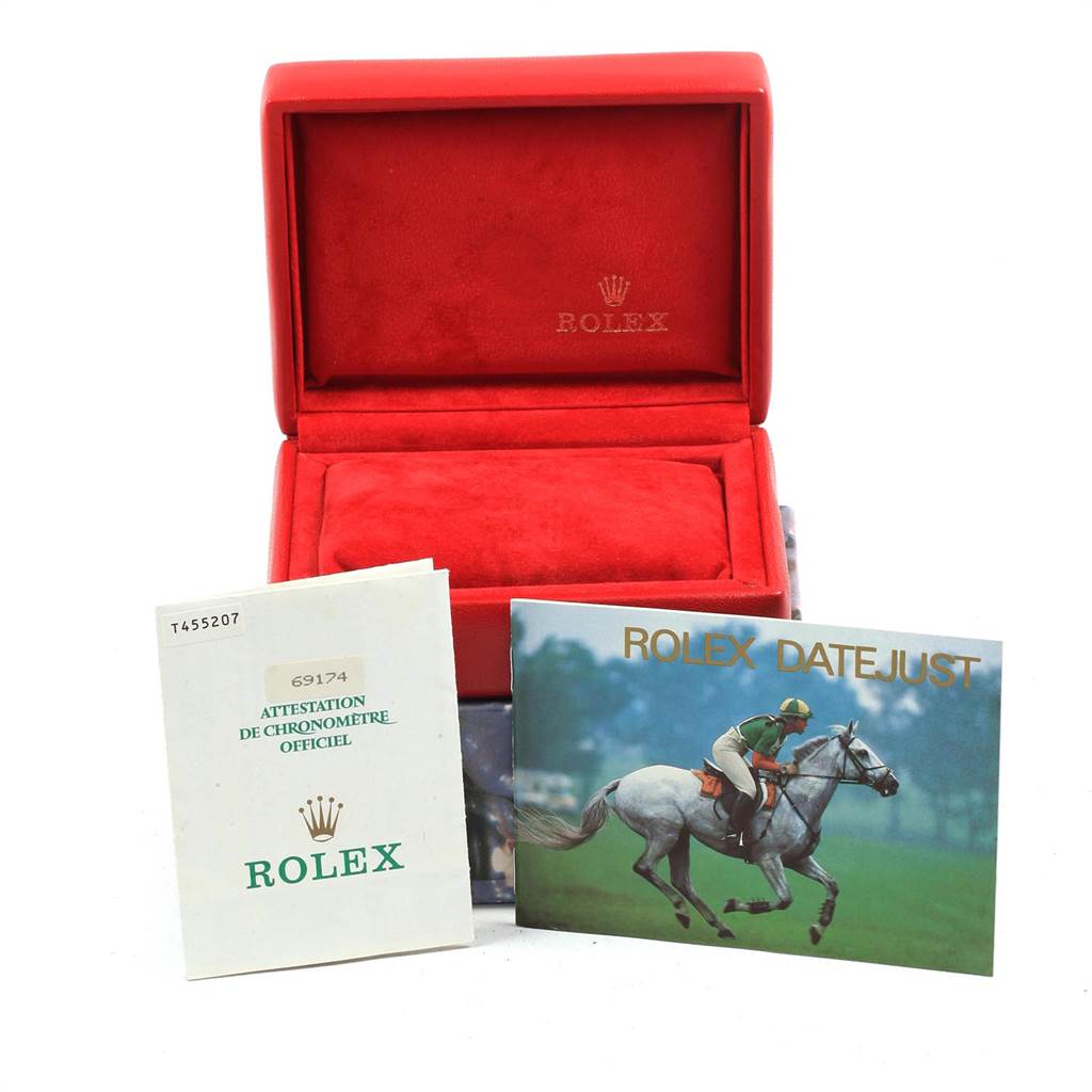 The image shows a red Rolex Datejust 69174 Women's Stainless Steel Pink Dial 69174 Women's Stainless Steel Pink Dial watch box with accompanying booklets, displayed at eye level.