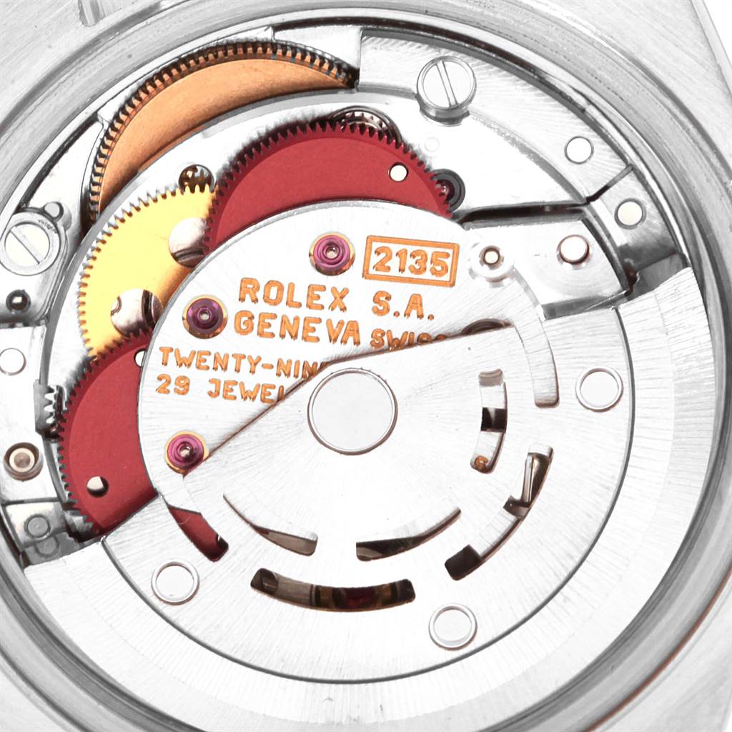 The image shows the movement of the Rolex Datejust 69174 Women's Stainless Steel Pink Dial 69174 Women's Stainless Steel Pink Dial model from an internal angle, highlighting the gears and inscription.