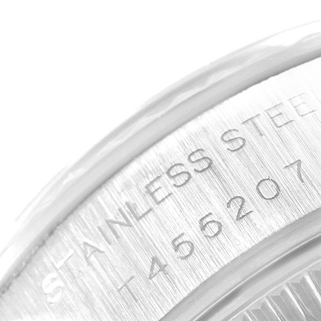 This close-up image shows the stainless steel back and part of the serial number of a Rolex Datejust 69174 Women's Stainless Steel Pink Dial 69174 Women's Stainless Steel Pink Dial watch.