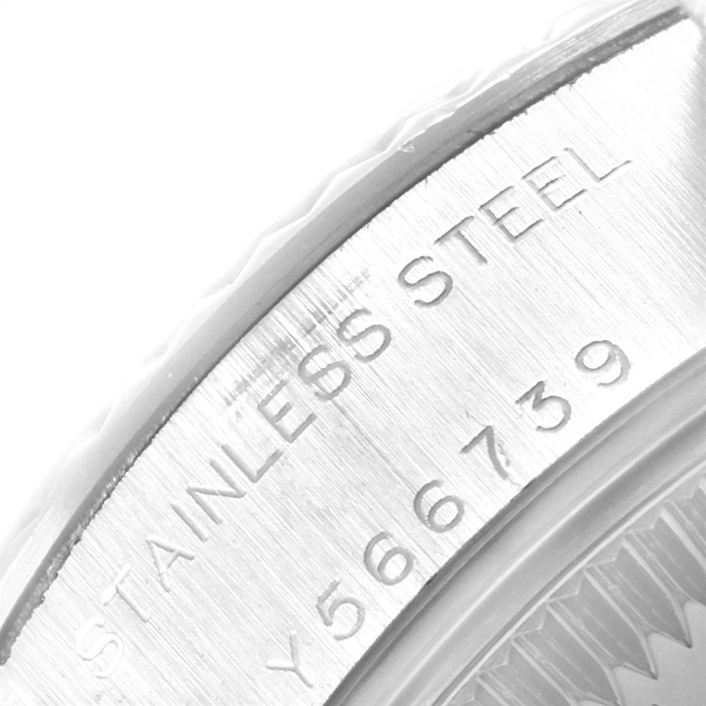 This image shows a close-up of the side view of the bezel and casing edge of a Rolex Datejust 79174 Women's Stainless Steel Silver Dial 79174 Women's Stainless Steel Silver Dial, highlighting the serial engraving.